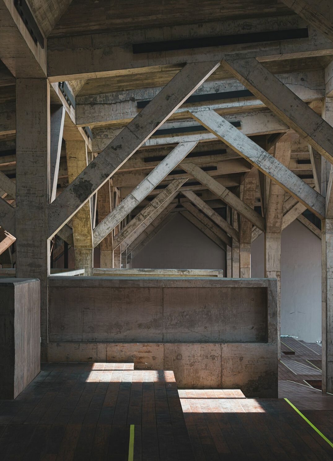 Architectural loft interior with exposed concrete and wood beams