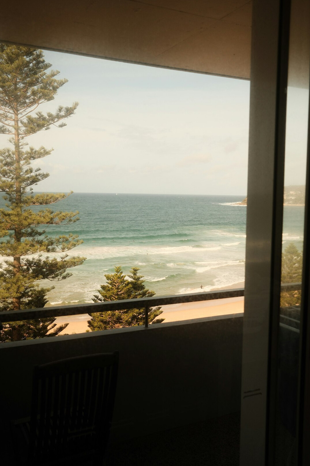 Modern high-rise apartment balcony overlooking the beach